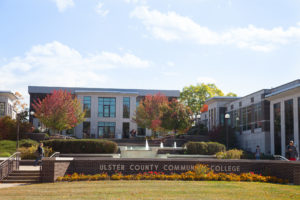 Photo of the main campus, and "Ulster County Community College" sign during the autumn. 