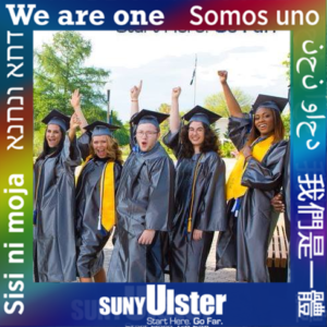 Photo of 5 students in their graduation cap and gowns with smiles on their faces with their left hands in the air. 