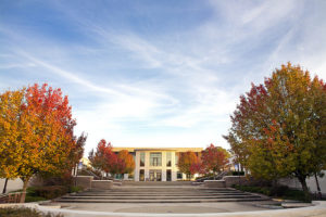 Image of SUNY Ulster Campus stairs with fall foliage on the trees. 