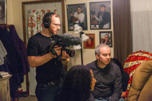 production still of co director Ben holding a camera
