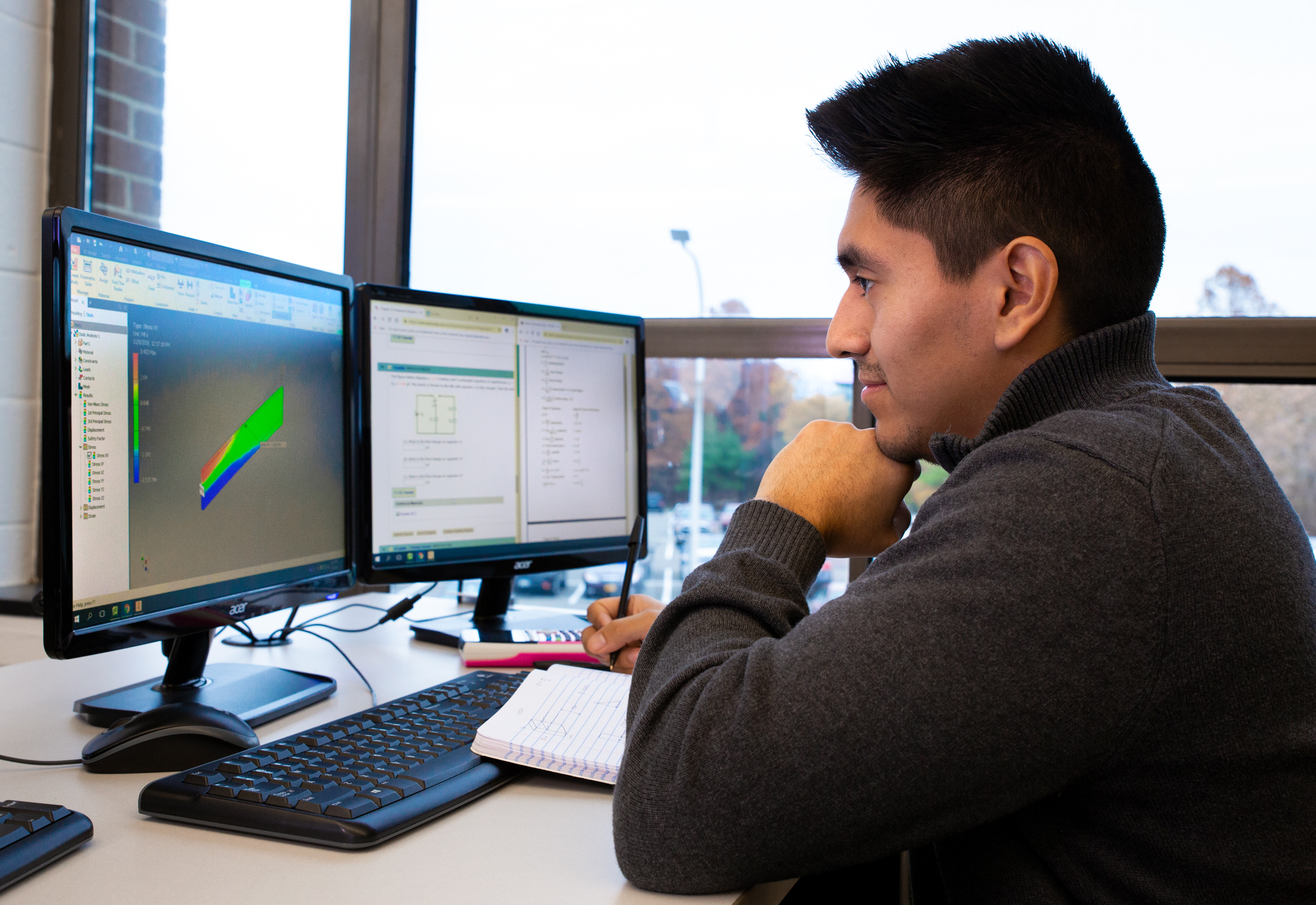 Student working on a computer project in class