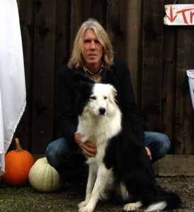 Portrait of John Steup and dog