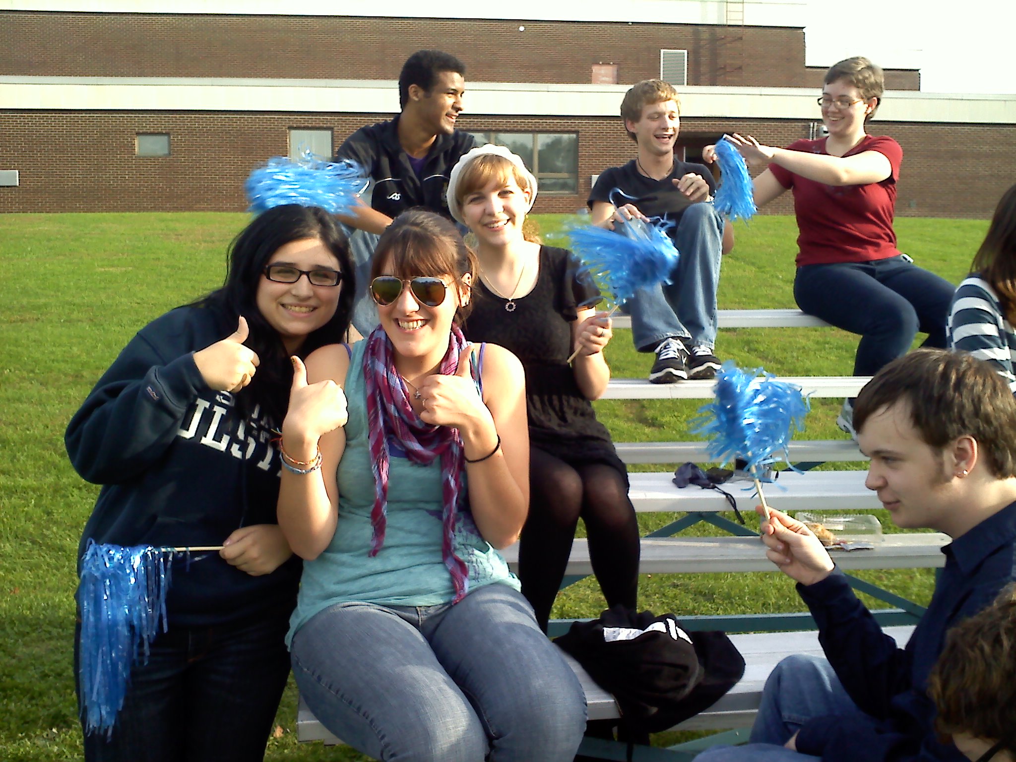 Happy SUNY Ulster students on bleachers