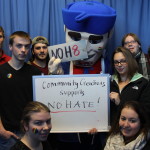 Students holding noh8 whiteboard with senator sam