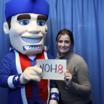 Woman with Senator Sam holding Noh8 sign