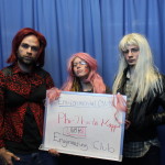 Students holding NoH8 Fall 2014 whiteboard