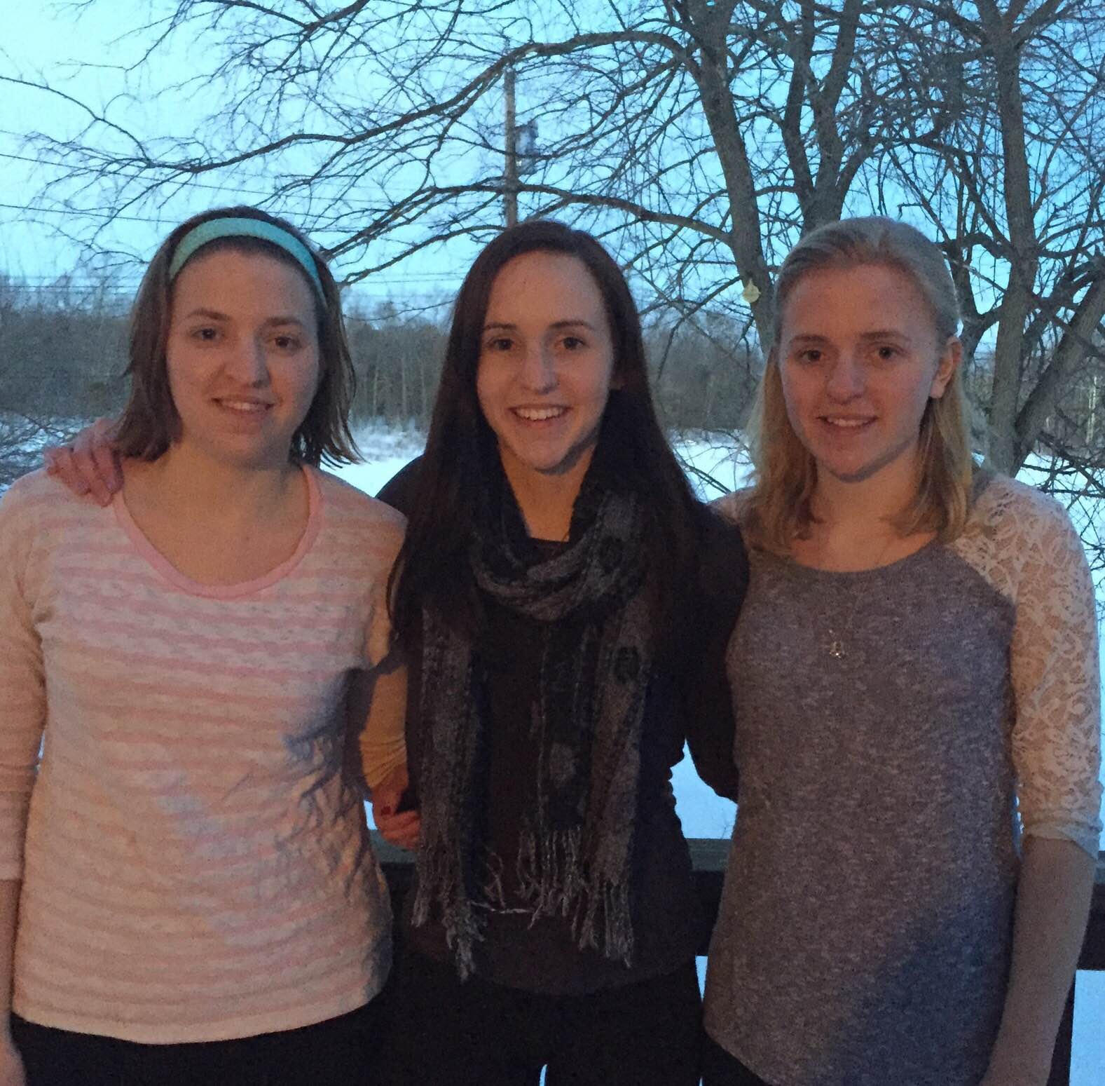 The Hart sisters stand with arms around each other