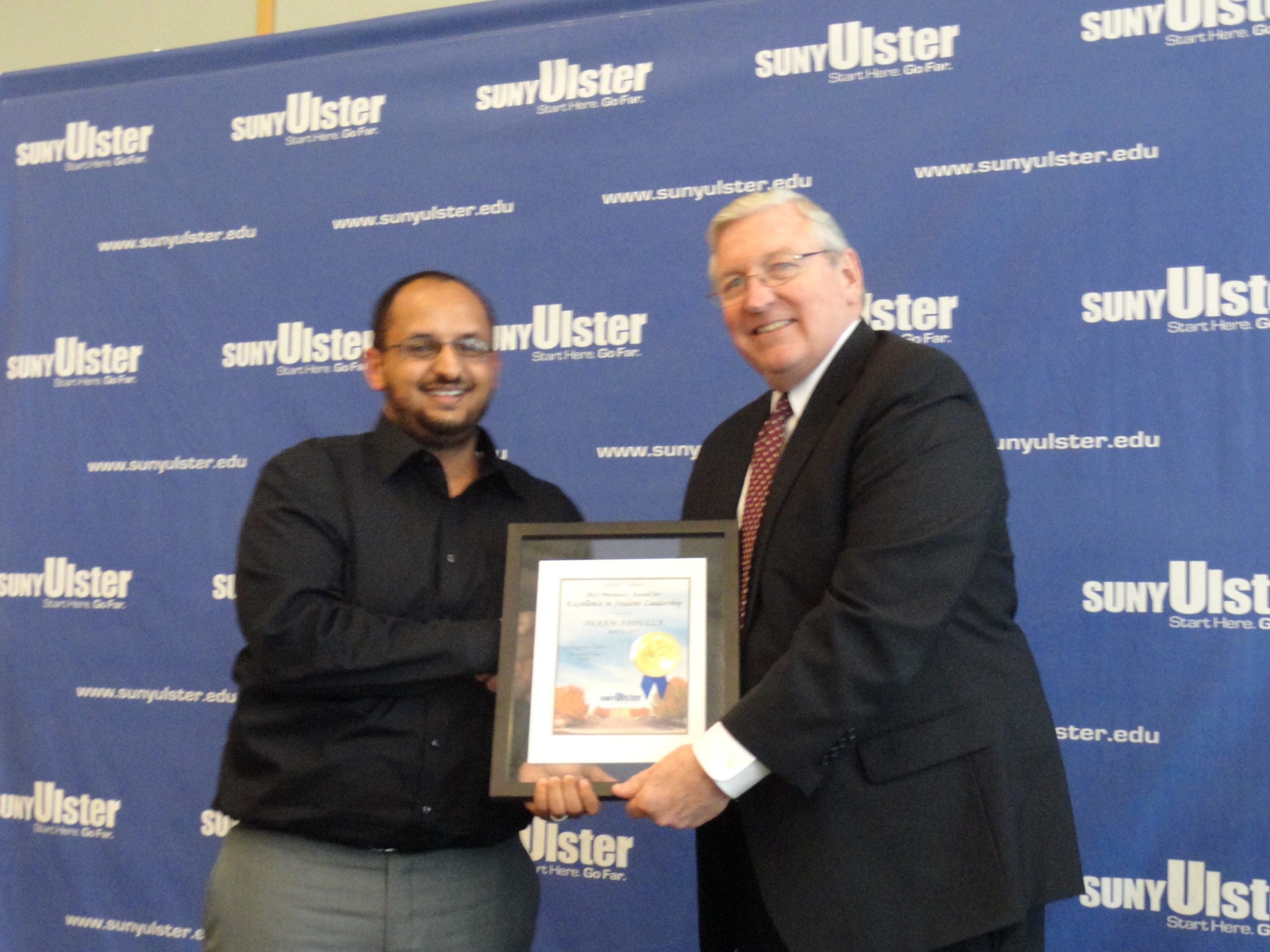 Akram Abdulla receving award from Donald Katt