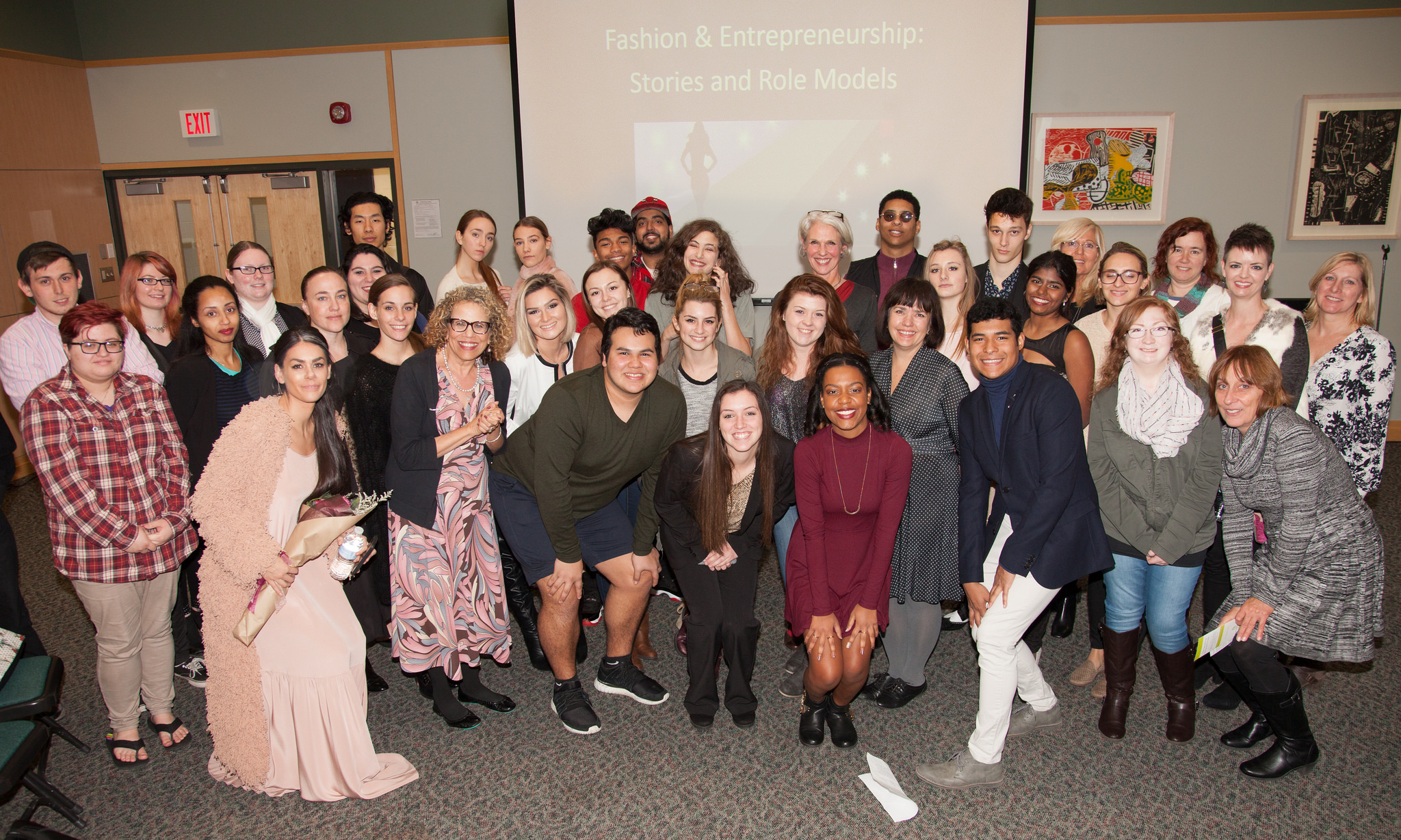Students and models looking at camera