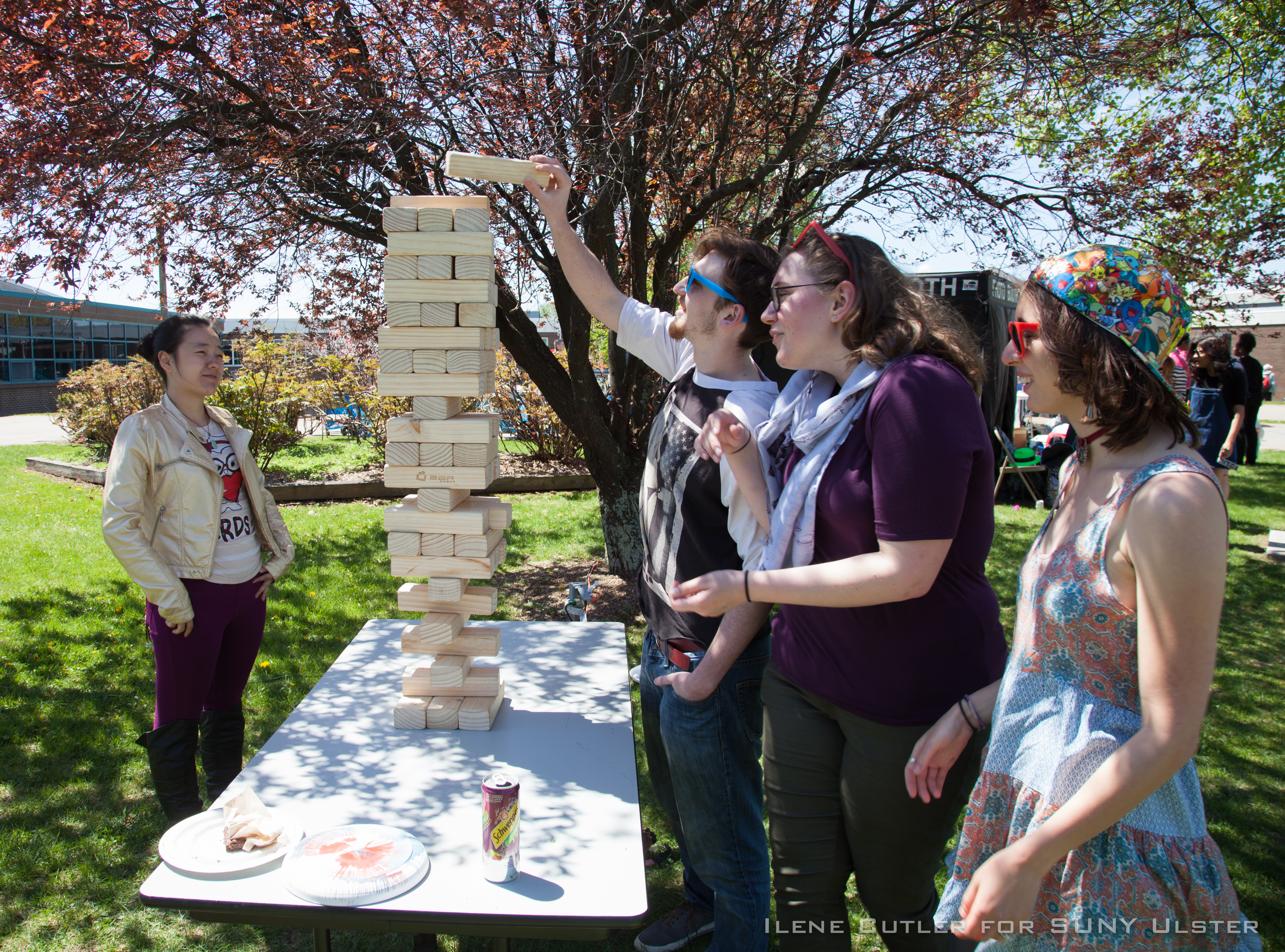 Students playing Jenga outside