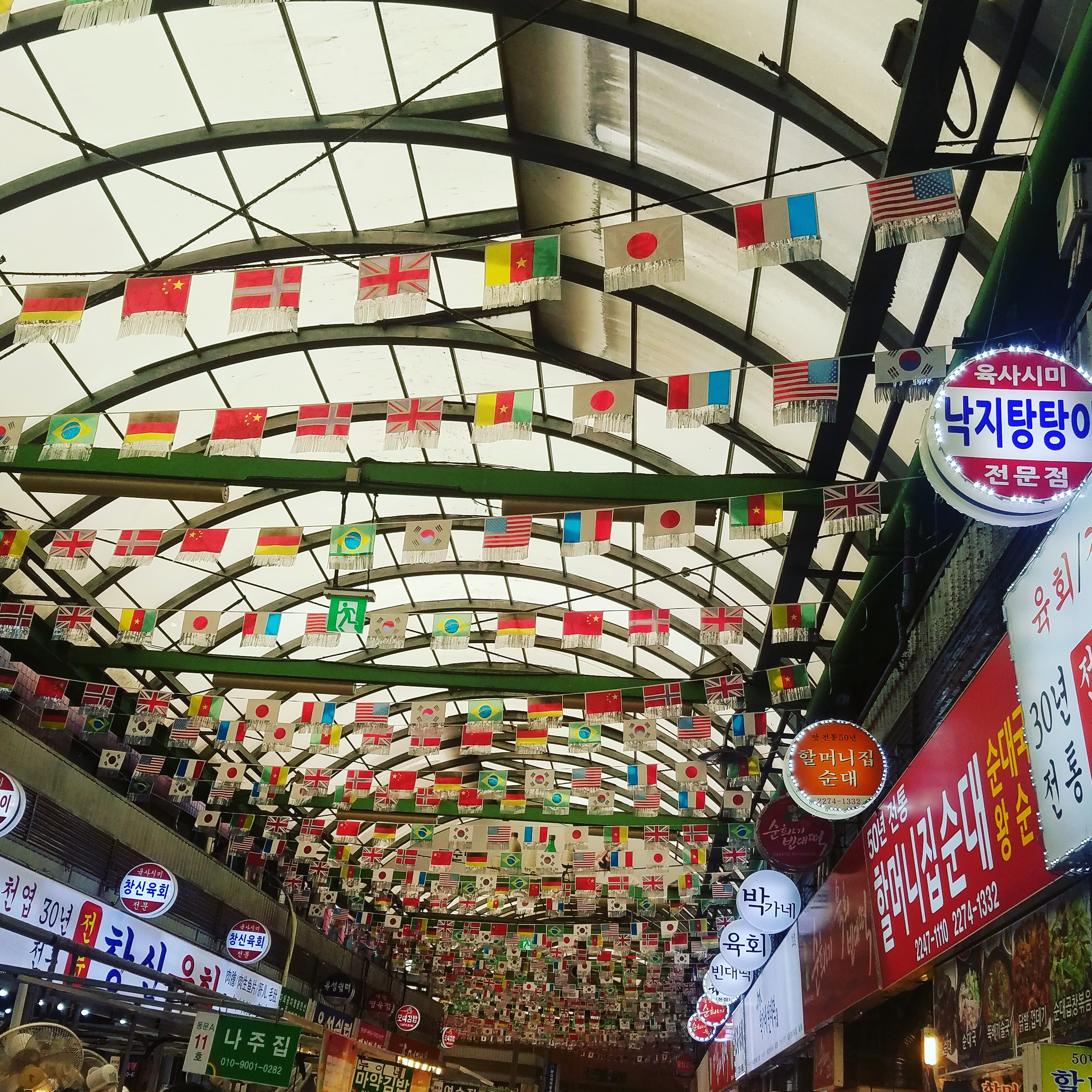 Flags flying on the ceiling of Gwangjang Market