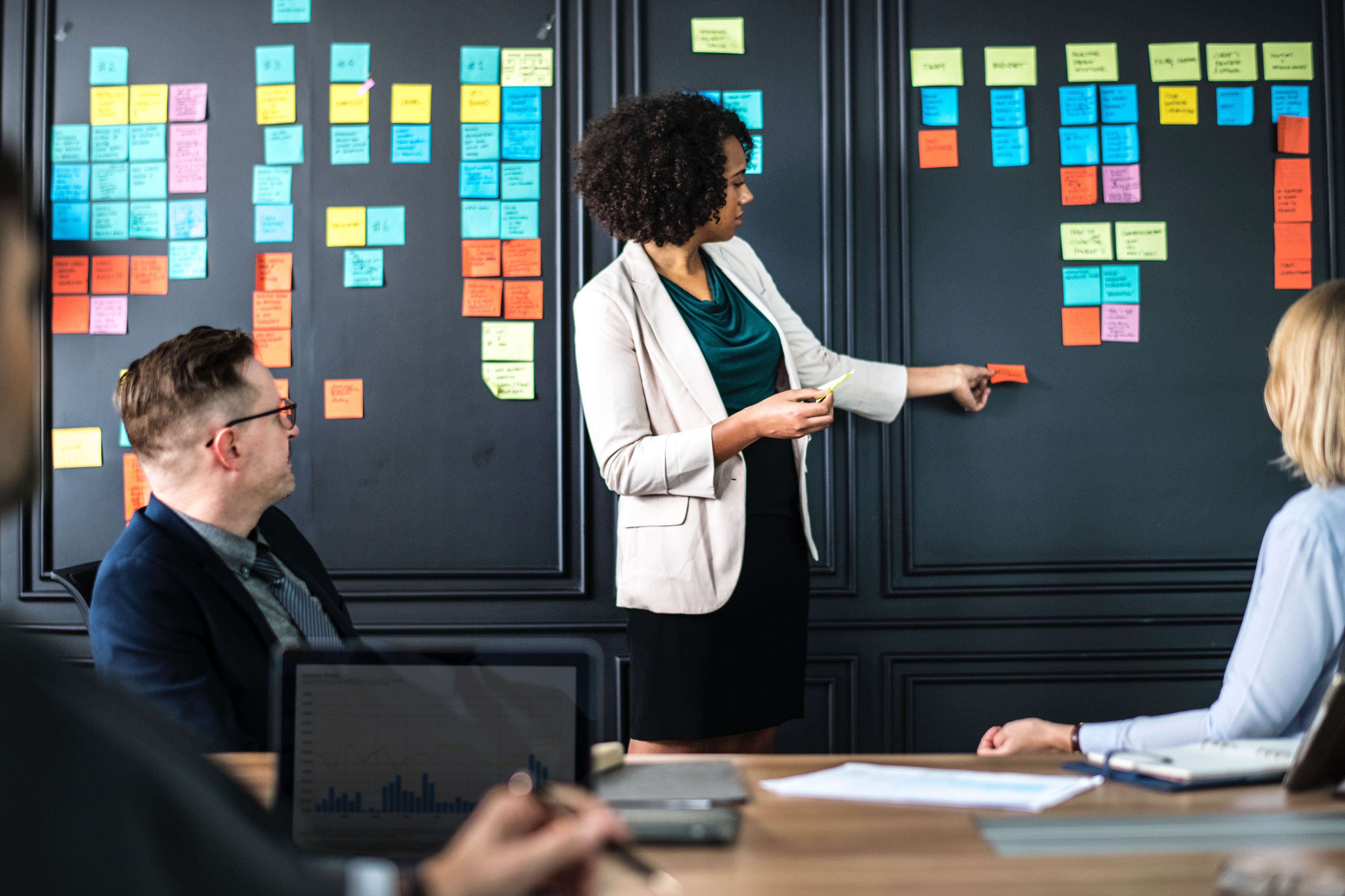 Woman presenting at a business meeting