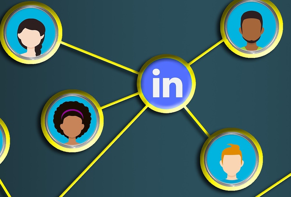 Cartoon heads connecting to a LinkedIn logo