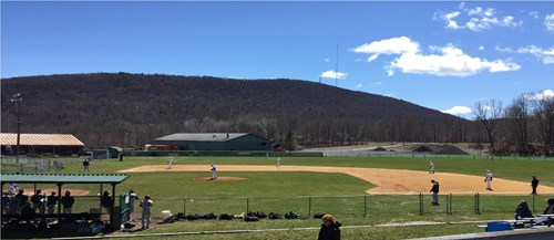 A baseball field with a background of the shawangunk mountains