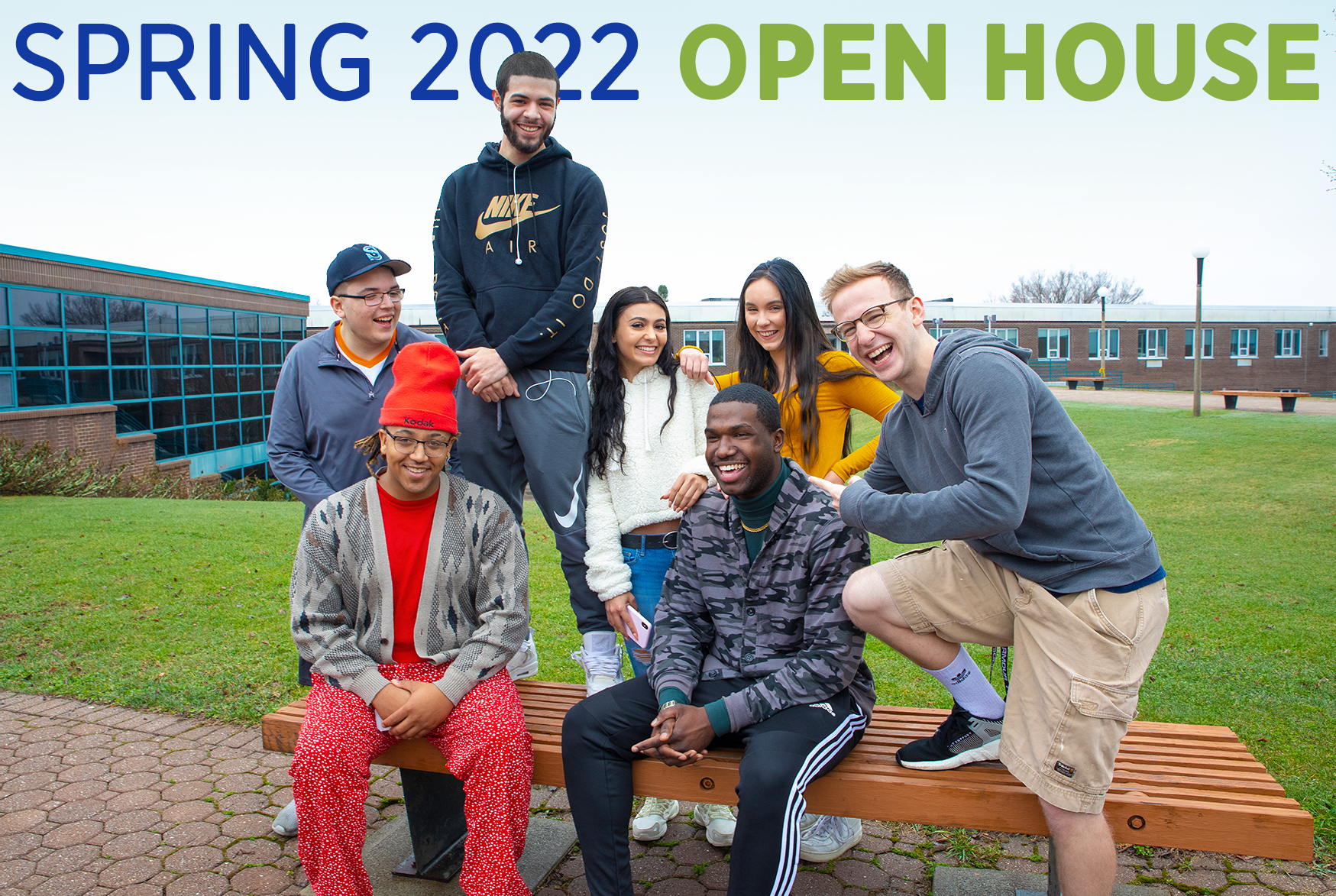 Students pose outside campus with 'Spring 2022 Open House' text overlay