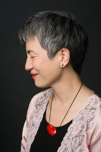 Portrait photograph showing Kimiko Hahn's side profile