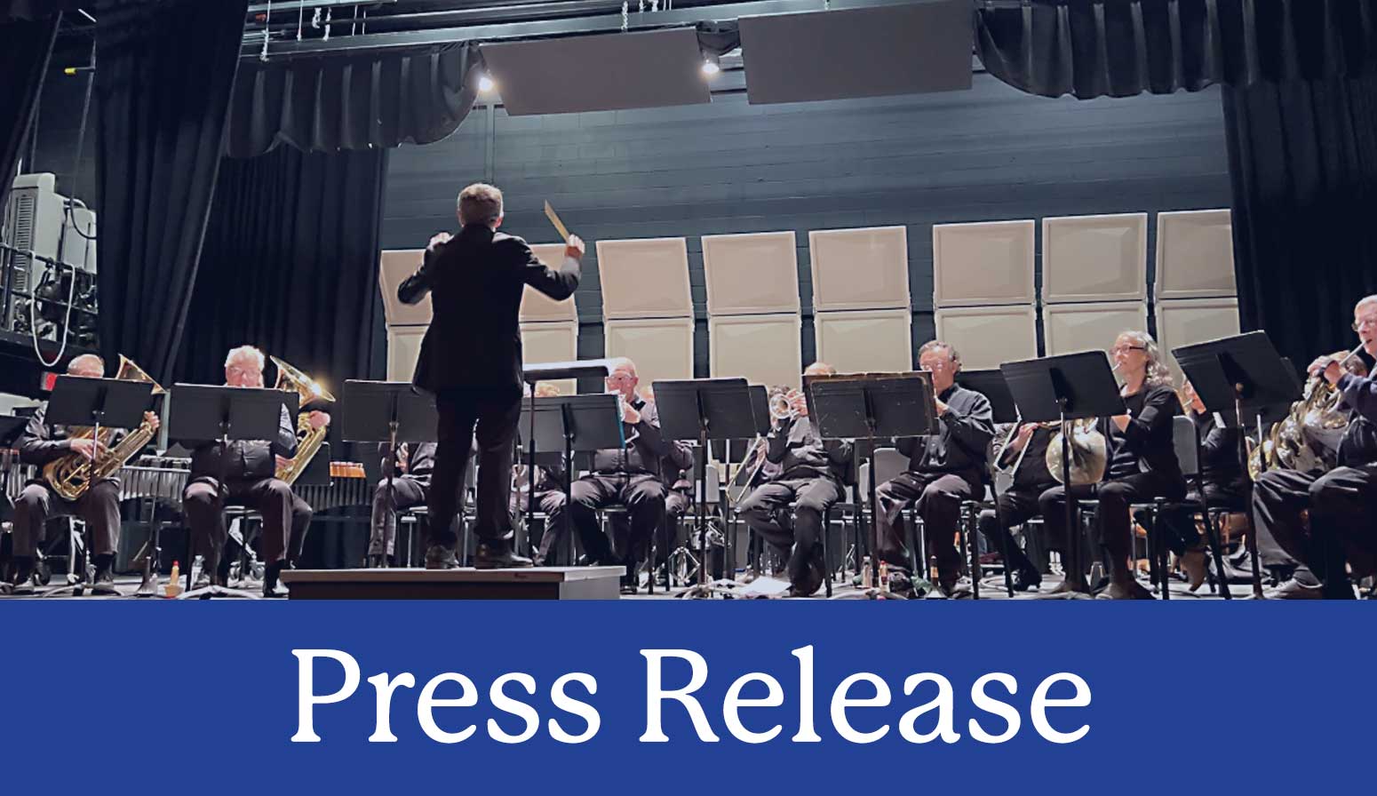 press release with photo of concert and conductor