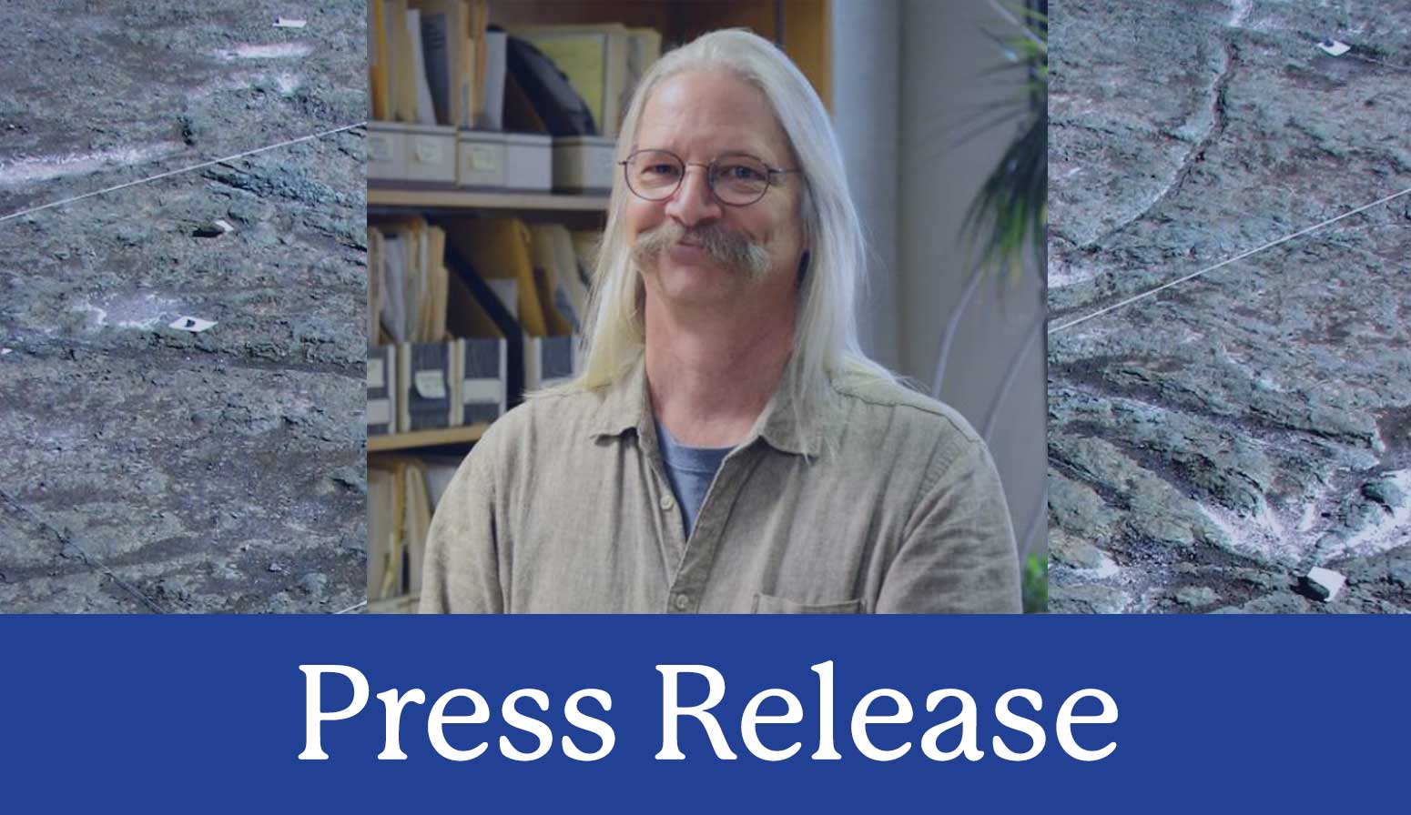press release image of Dr. Chuck Ver Straeten with fossils