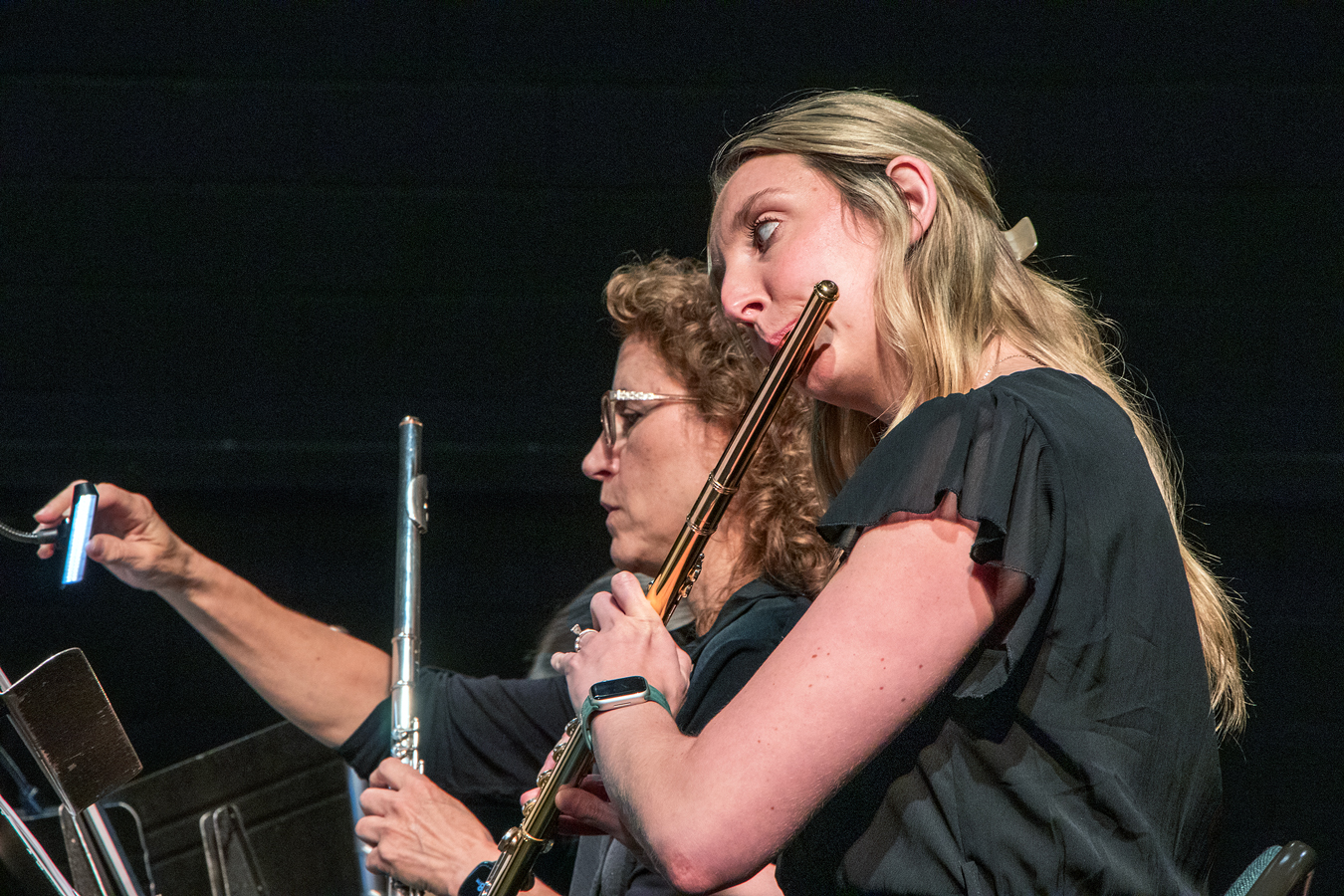 two women playing musical instruments